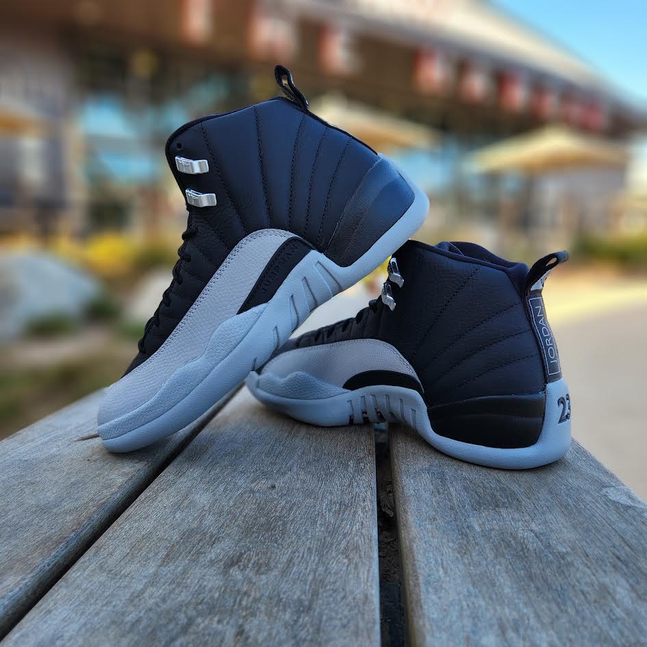 teal and black jordan 12s