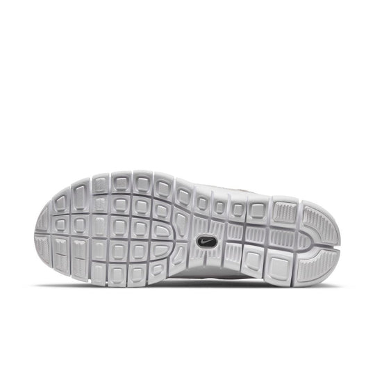 all white nike free run womens